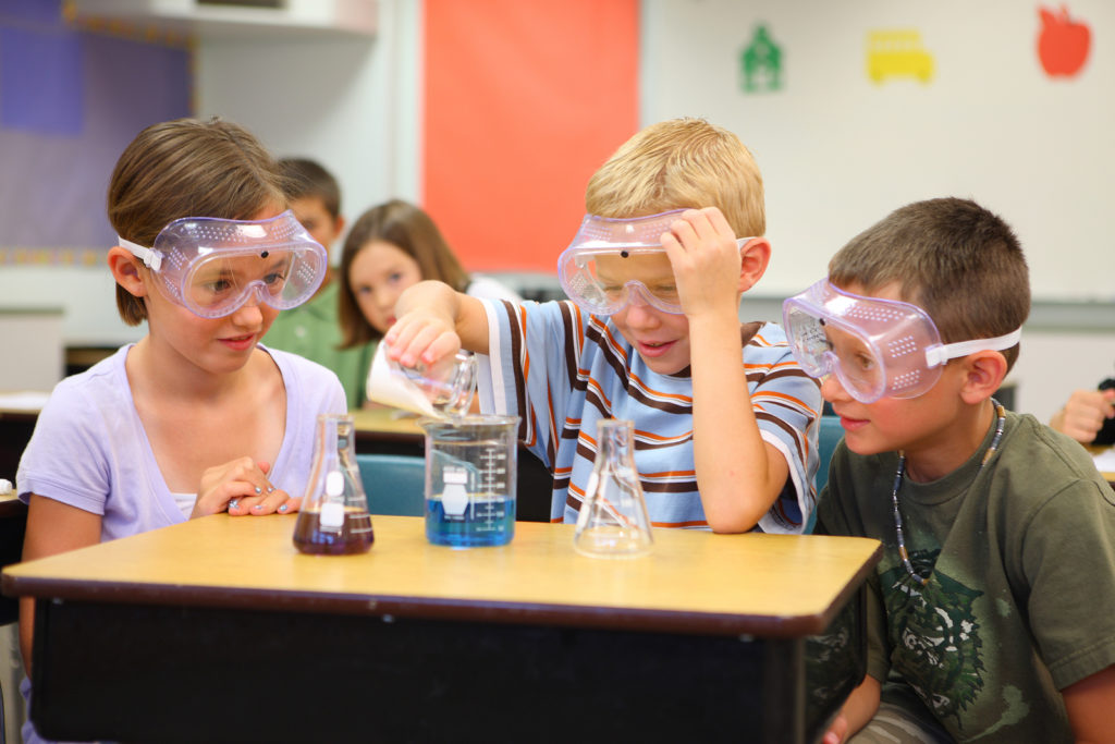 Elementary school students doing science experiment InsideSources