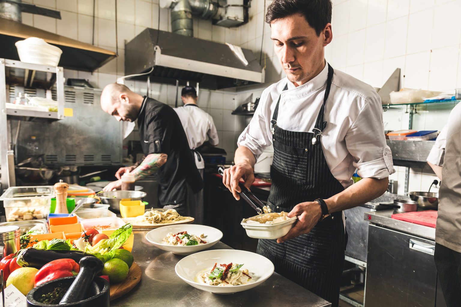 Professional Chef Cooking In The Kitchen Restaurant At The Hotel ...